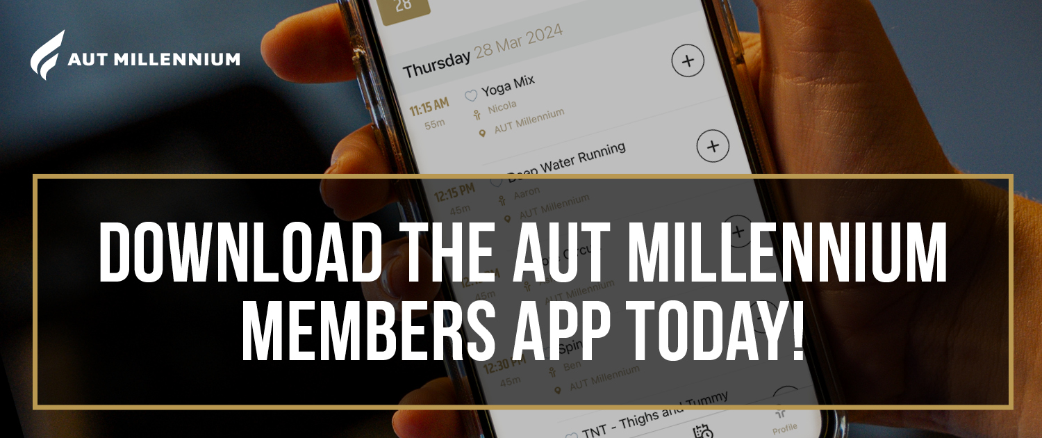 A member holding their phone with the AUT Millennium app open on their screen