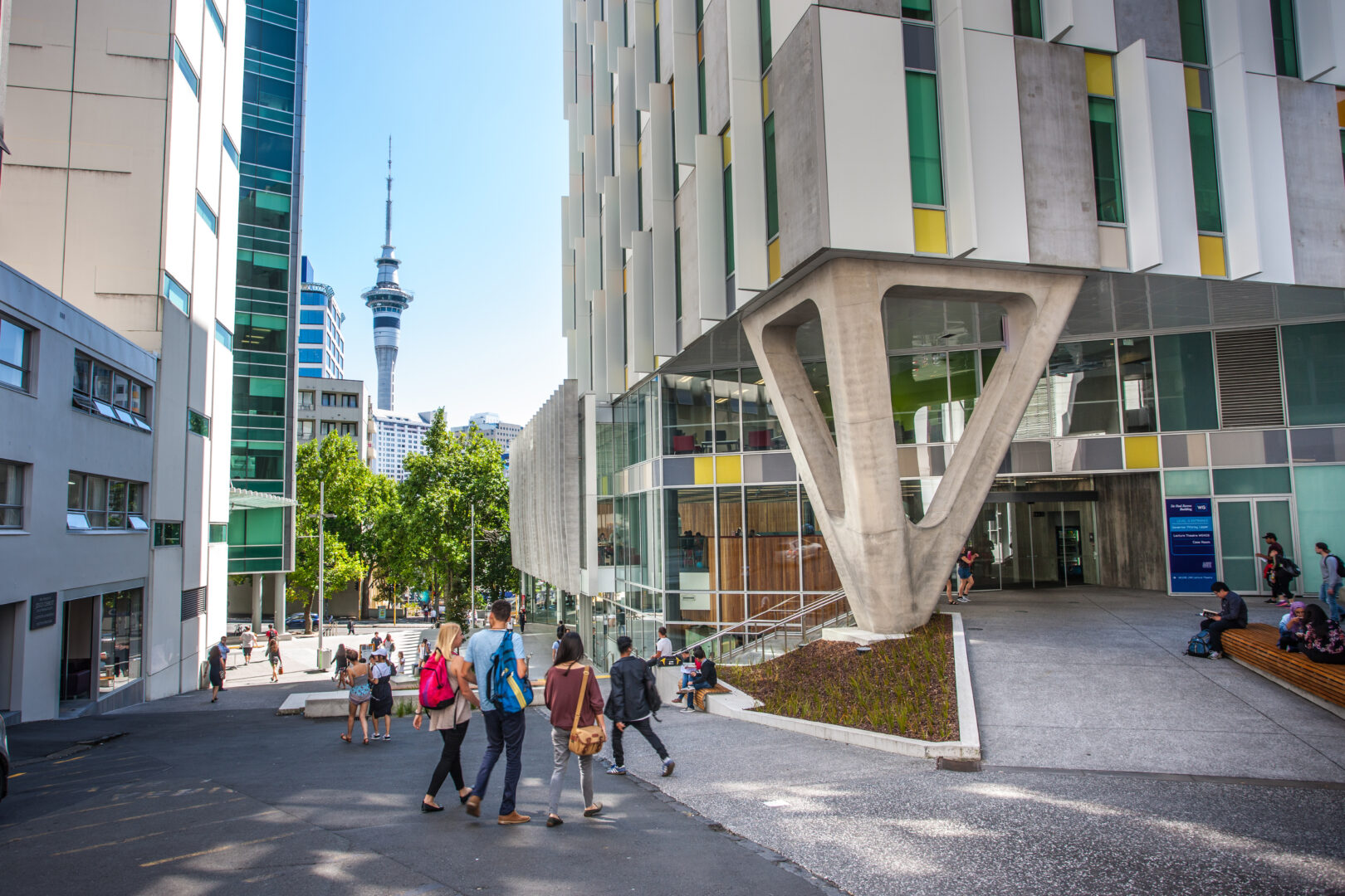 AUT University Campus with students walking with backpacks and Sky Tower in background