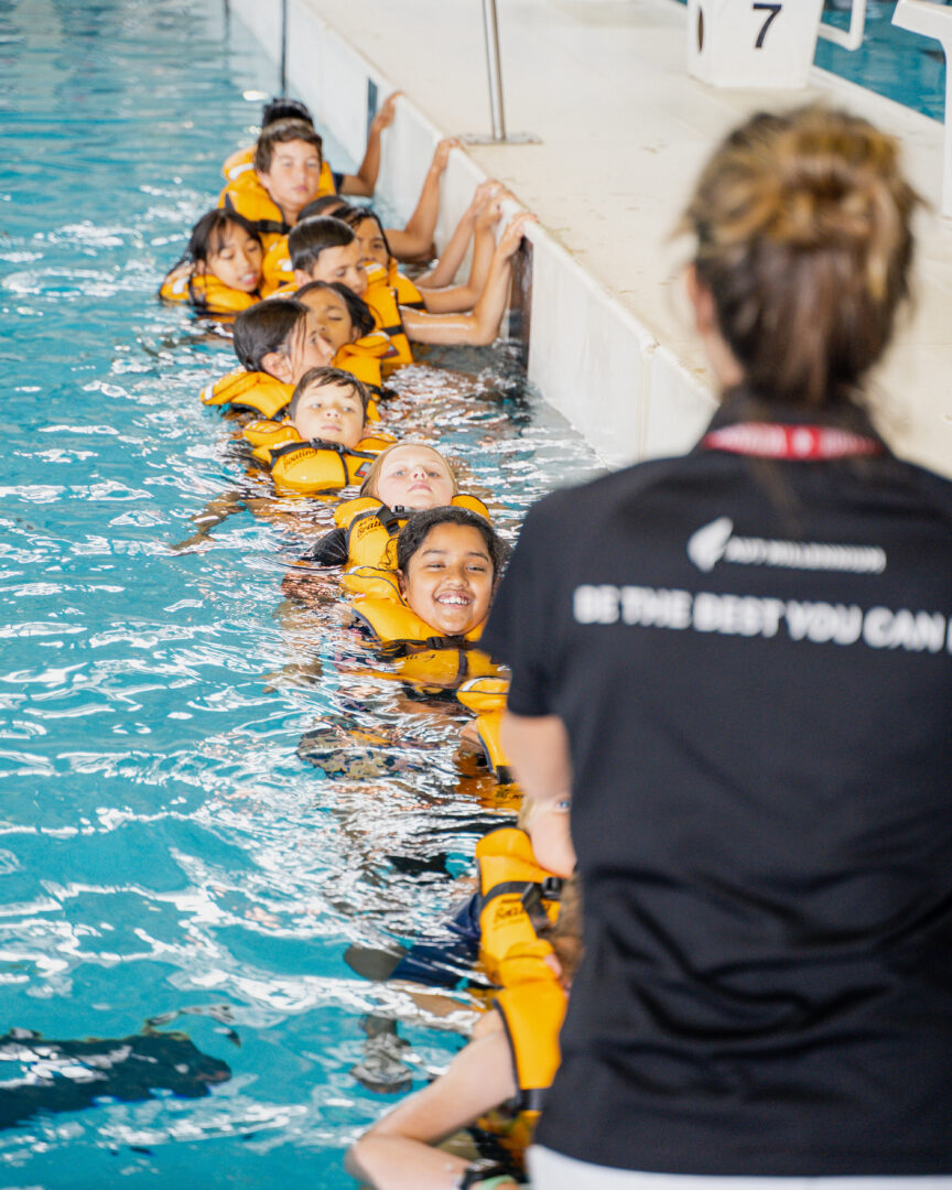 Schools Programme, teacher instructing children in lifejackets
