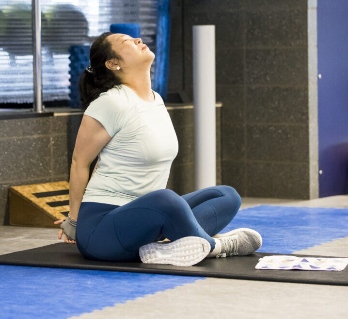A person stretching in the stretching area