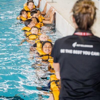 Schools Programme Schools Programme, teacher instructing children in lifejackets