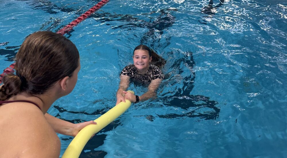 Surf Safety Surf safety girl being rescued in pool using a pool noodle