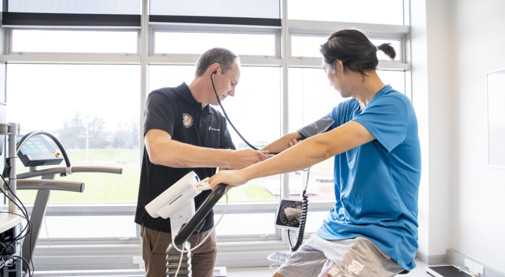 Human Potential Client getting their blood pressure checked